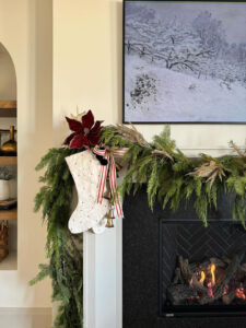 Closeup of fireplace with Christmas stocking.