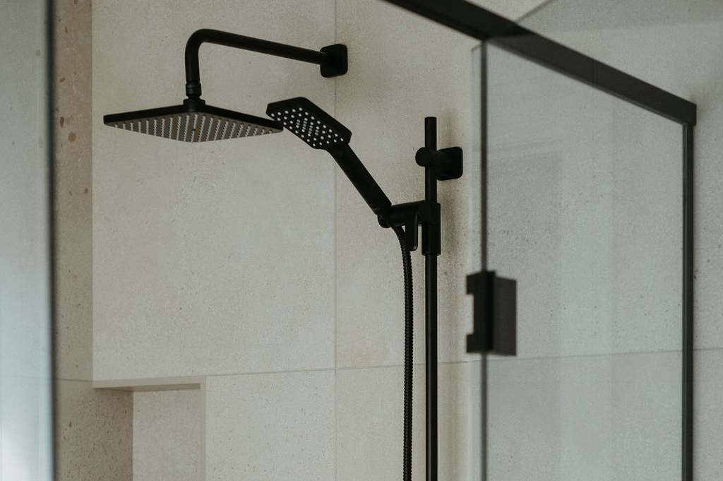 Close up of black shower fixture.